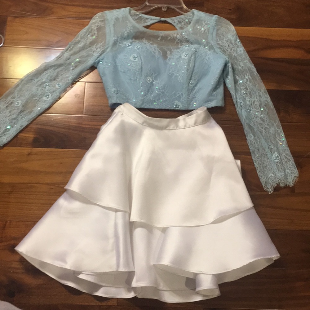Two piece light lace top with white ruffled skirt